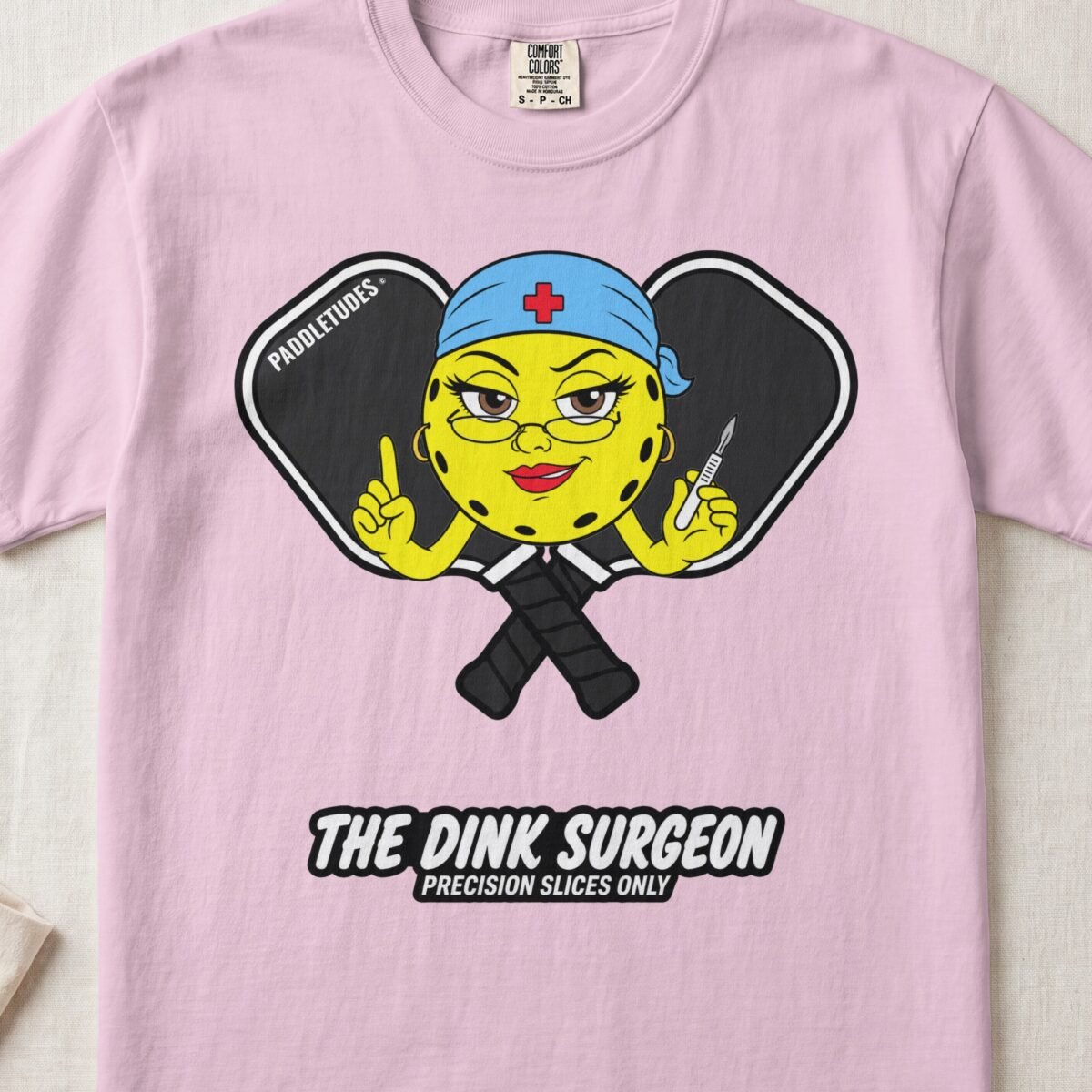 The Dink Surgeon – Pickleball Personality — Funny Pickleball Attitude Shirt on Comfort Colors 1717