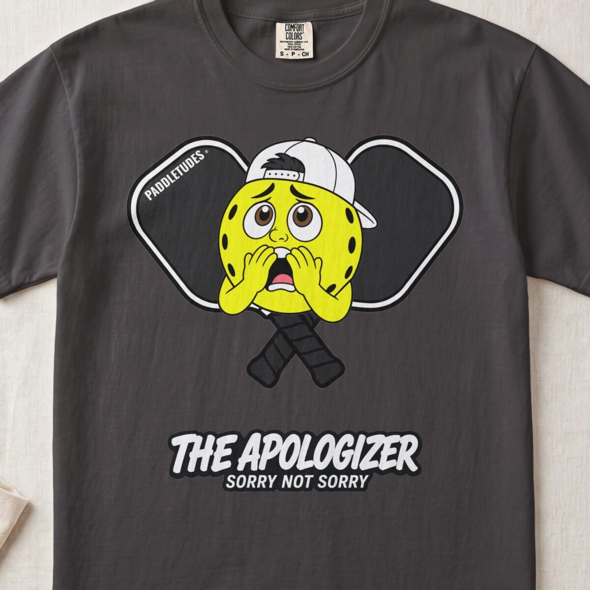 The Apologizer – Pickleball Personality — Funny Pickleball Attitude Shirt on Comfort Colors 1717
