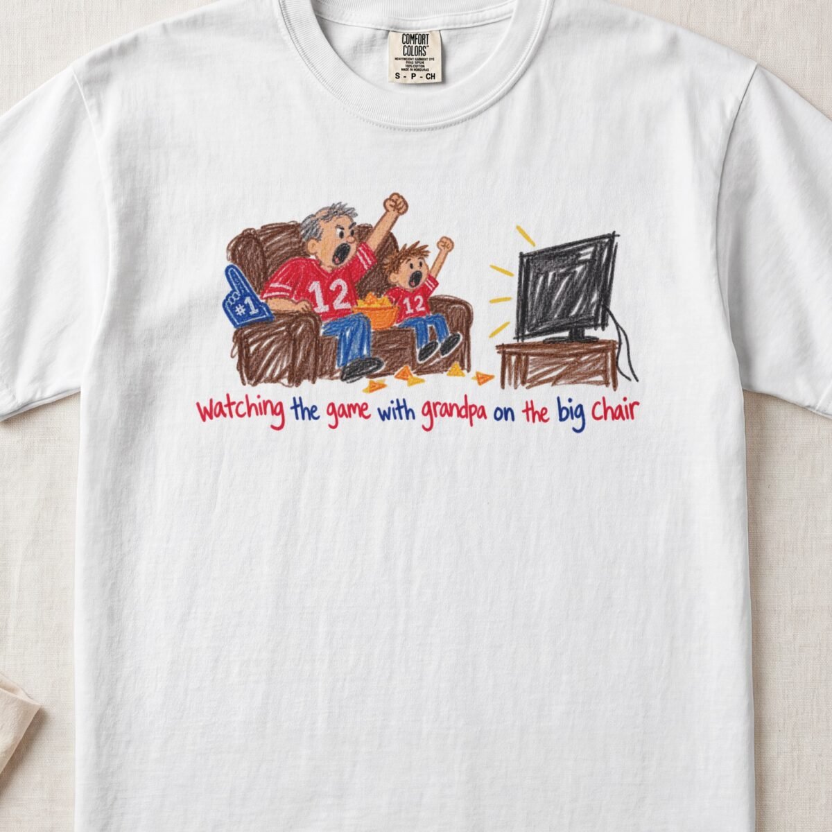 Watching The Game With Grandpa On The Big Chair — Little Hands Tee on Comfort Colors 1717